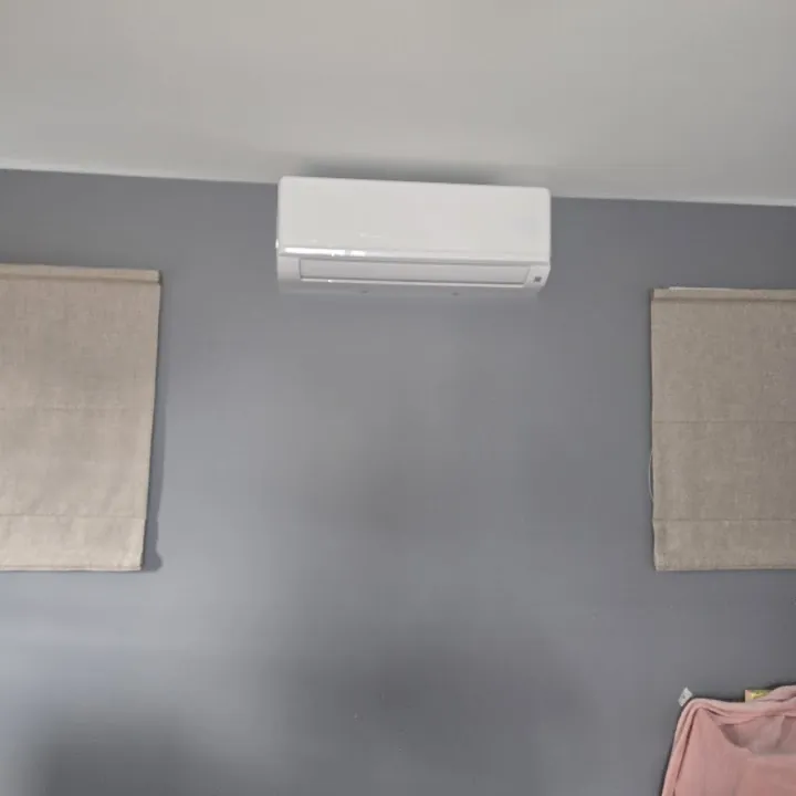 Heat pump mounted on a lounge wall