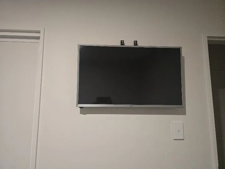 Wall-mounted TV with no visible cables